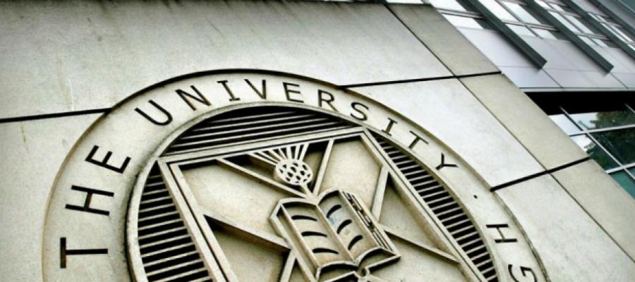 university of edinburgh crest on wall of building