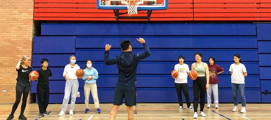 an instructor teaching two teams of four to play