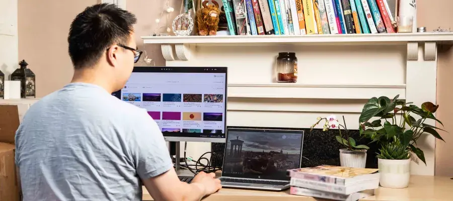 young man working online at desk