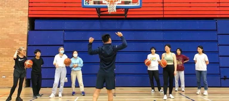 an instructor teaching two teams of four to play