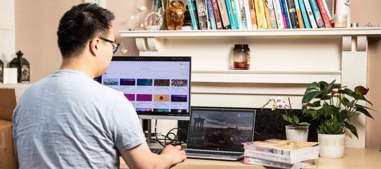 young man working online at desk