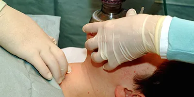 Respirator being held to patients face