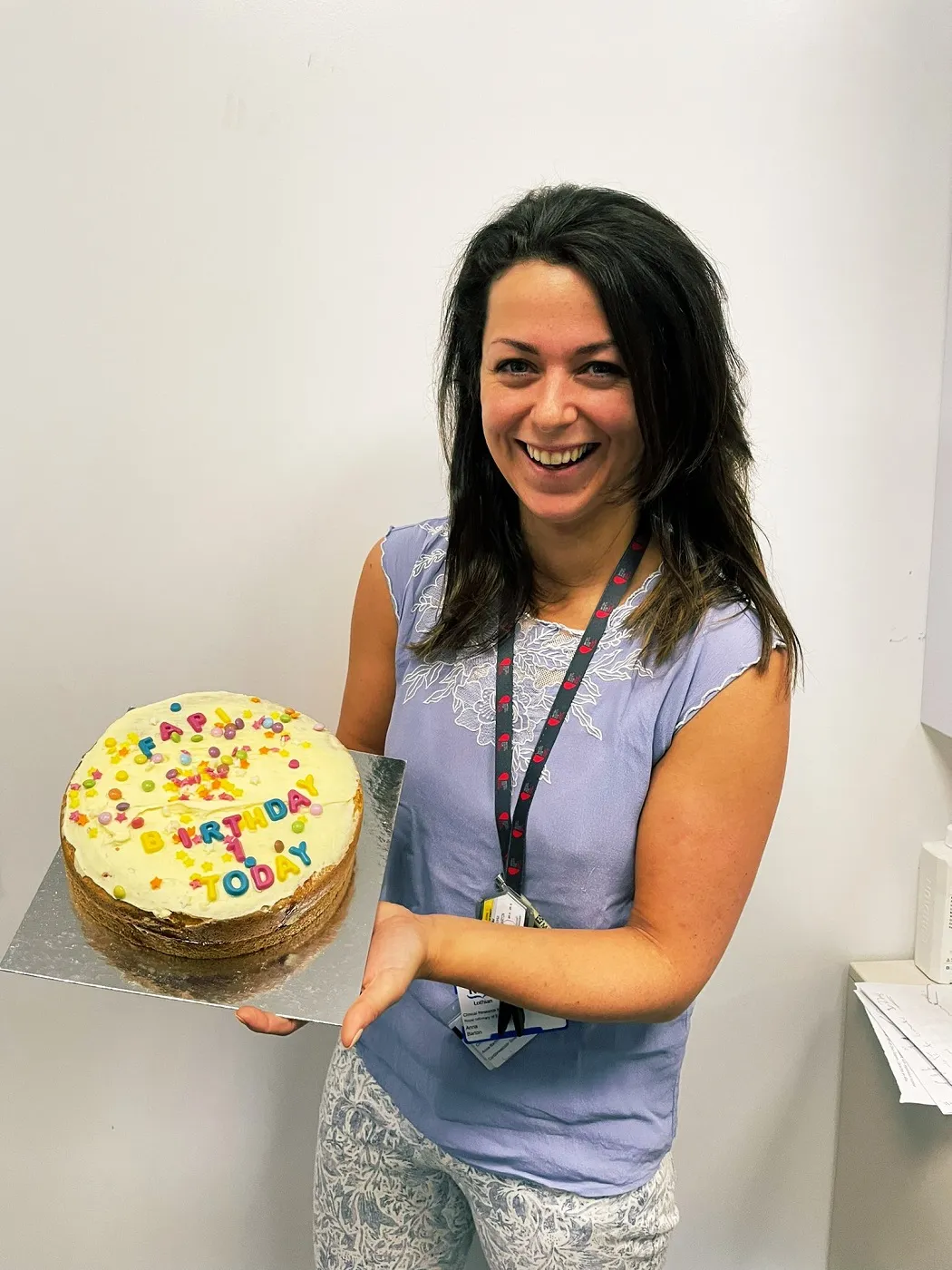 Dr Anna Barton and a celebratory cake to mark the one year anniversary of the first FAPI PET-MR scan.