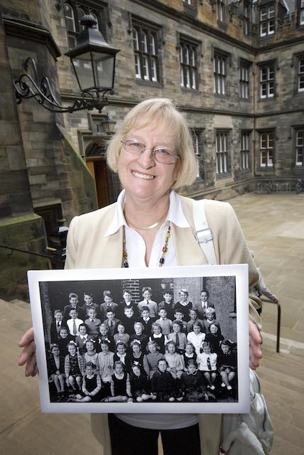 LBC participant with school photo at reunion.